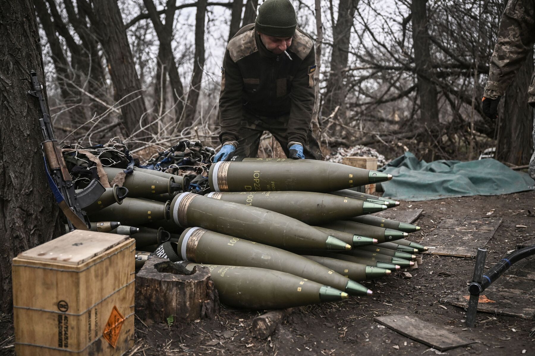 Ukraine soldier sorting artillery rounds 155mm